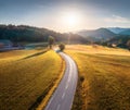 Aerial view of road in alpine meadows at sunset in autumn Royalty Free Stock Photo