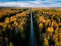 Aerial view of road in autumn forest. Fall landscape with road, red and yellow trees. Royalty Free Stock Photo