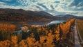 Aerial view of road in beautiful autumn Altai forest Royalty Free Stock Photo