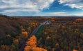 Aerial view of road in beautiful autumn Altai forest Royalty Free Stock Photo