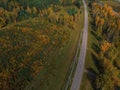 Aerial view of road in beautiful autumn Altai forest Royalty Free Stock Photo