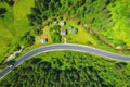 Aerial view of road in beautiful green forest at sunset Royalty Free Stock Photo