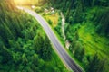 Aerial view of road in beautiful green forest at sunset Royalty Free Stock Photo