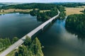 Aerial view of road bridge over blue lake water and green woods in Finland Royalty Free Stock Photo