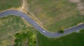 Aerial view road curve construction. Aerial above view of a rural landscape with a curvy road running through. Aerial view of curv