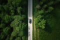 Aerial view road and forest. Road going through forest with car view from above. Generative AI Royalty Free Stock Photo