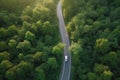 Aerial view road and forest. Road going through forest with car view from above. Generative AI Royalty Free Stock Photo