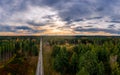 Aerial view of road among the forest and trees. Sunset field in southern germany near the alps. Royalty Free Stock Photo