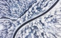Aerial view on the road and forest at the winter time. Natural winter landscape from air. Forest under snow a the winter time. Royalty Free Stock Photo
