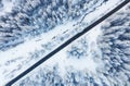 Aerial view on the road and forest at the winter time. Natural winter landscape from air. Forest under snow a the winter time. Royalty Free Stock Photo