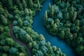 Aerial view of road with green woods by blue lakes water, beautiful view