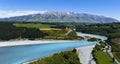 Aerial view with road of highway as bridge at Rakaia River lagoon Valley as green field againts with blue sky