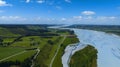 Aerial view with road of highway at Rakaia River lagoon Valley as green field