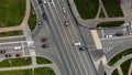 Aerial view of road junction or road intersection in city with cars turning left and righ Royalty Free Stock Photo