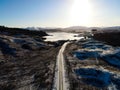 Aerial view of a road leading to the frozen Loch Doon in Scotland Royalty Free Stock Photo