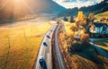 Aerial view of the road in mountain valley at sunset in autumn