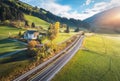 Aerial view of the road in mountain valley at sunset in summer