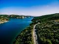 Aerial View of road near blue sea and green mountain in summer Croatia Royalty Free Stock Photo