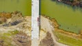 Aerial view on road over river under construction, building the bridge Royalty Free Stock Photo