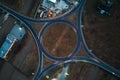 Aerial view of road roundabout intersection with fast moving heavy traffic at night. Top view of urban circular Royalty Free Stock Photo