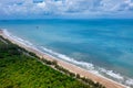 Aerial view of road between tree and great ocean with blue sky in Thailand Royalty Free Stock Photo
