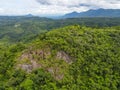 Aerial view rock cliff forest trees background jungle nature green tree on the mountain top view , forest hill landscape scenery Royalty Free Stock Photo