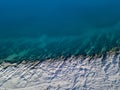 Aerial view of rocks on the sea. Overview of the seabed seen from above, transparent water