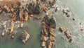 Aerial view rocks and stones on the Arambol beach in North Goa, India.