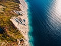 Aerial view of cliff, coastline and blue sea with waves Royalty Free Stock Photo