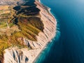 Aerial view of cliff, coastline and blue sea with waves Royalty Free Stock Photo