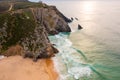 Aerial view of rocky cliff coastline with ocean waves Royalty Free Stock Photo