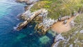 Rocky coastline, a small beach. Island of Virgen del Mar. Cantabria, Spain Royalty Free Stock Photo