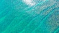 Aerial view rocky seashore with sandy beach. seascape ocean surf and tropical beach large waves turquoise water crushing Royalty Free Stock Photo