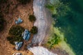 Aerial view of the rocky shore of green algal Seetalsee lake in Ramsau am Dachstein, Austria