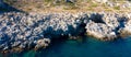 Aerial view of a rocky stone island in clear green blue sea, Greece Royalty Free Stock Photo