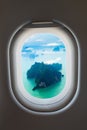 Aerial View of Rocky, Tropical Islands from a Passenger Window