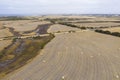 Rolled hay bales in a dry agricultural field in regional Australia Royalty Free Stock Photo