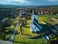 Aerial view of Roman Catholic Church of All Saints in Ocova in podpolanie region during winter