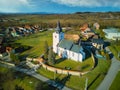 Aerial view of Roman Catholic Church of All Saints in Ocova in podpolanie region during winter