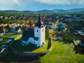 Aerial view of Roman Catholic Church of All Saints in Ocova in podpolanie region during winter