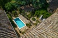 Aerial view from the roof of the modern villa of a swimming pool with a garden on a sunny weather Royalty Free Stock Photo