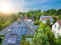 Family houses in gardens, photovoltaic panels on the roof, summer, sunny. Royalty Free Stock Photo