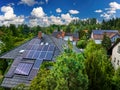 Aerial view of the roofs of houses covered with solar panels. Royalty Free Stock Photo