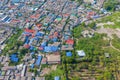 Aerial view of roofs of village houses. Residential buildings in Bangkok Downtown, Thailand. Urban city in Asia. Architecture