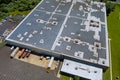 Aerial view rooftop on the solar panel energy for generating electricity with of building warehouse an industrial zone Royalty Free Stock Photo