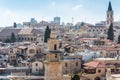 Aerial view of rooftops of buildings of Muristan area in the old city of Jerusalem. Minaret of Mosque of Omar View from the Royalty Free Stock Photo