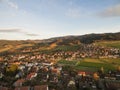 aerial view of rooftops houses and beautiful green hills