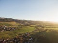 aerial view of rooftops houses and beautiful green hills with trees