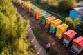 aerial view of a row of colorful beehives