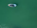 Aerial view of a rowing blue boat in a harbor. Nature and marine landscape